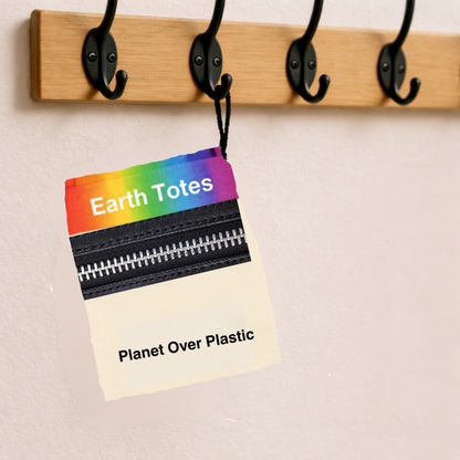 Earth Totes rainbow mesh bag folded into pocket and hanging on a hook